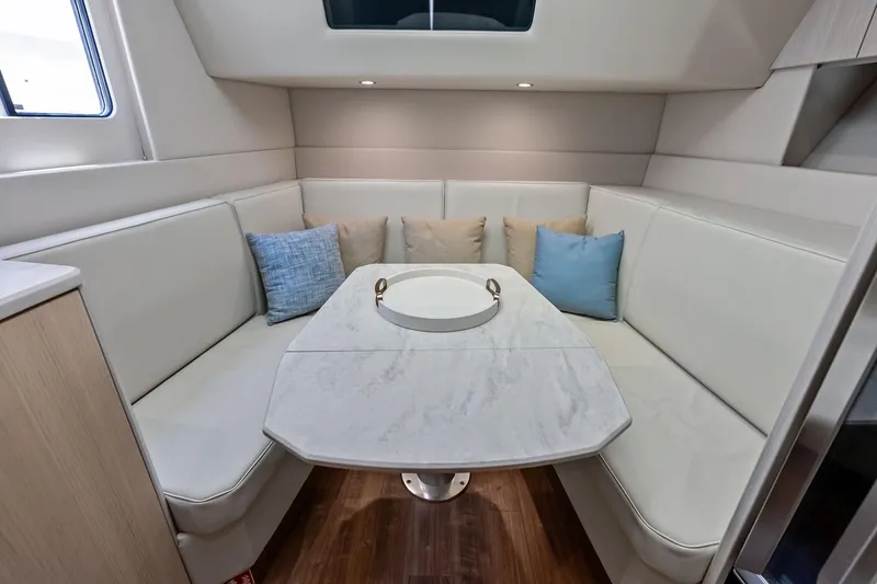 Slide: The Image of Luxurious interior of 2025 Formula 500 Super Sport Crossover with elegant seating and table. - 25