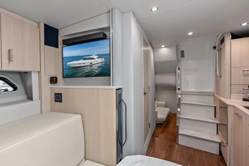 Slide: The Image of Interior of 2025 Formula 500 Super Sport Crossover yacht with modern design and TV display. - 29