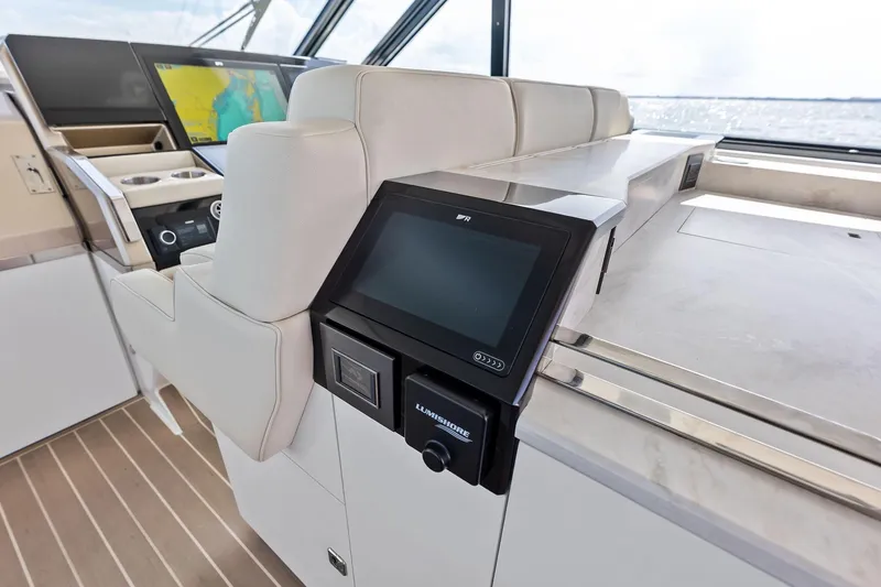 Slide: The Image of Interior of 2025 Formula 500 Super Sport Crossover with advanced navigation system and luxurious seating. - 34