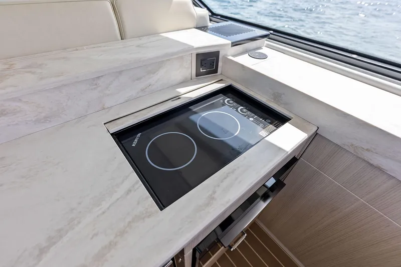 Slide: The Image of Modern kitchen area on 2025 Formula 500 Super Sport Crossover yacht with induction cooktop. - 39