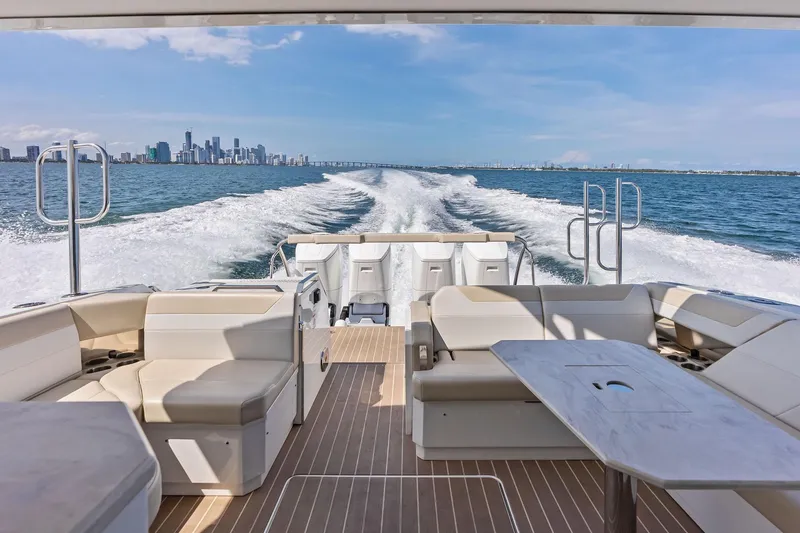 Slide: The Image of 2025 Formula 500 Super Sport Crossover cruising with city skyline in the background. - 42