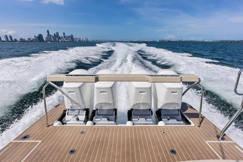 Slide: The Image of 2025 Formula 500 Super Sport Crossover cruising with city skyline in the background. - 43