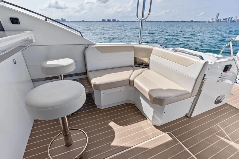 Slide: The Image of Luxurious seating area on 2025 Formula 500 Super Sport Crossover yacht, overlooking ocean skyline. - 47