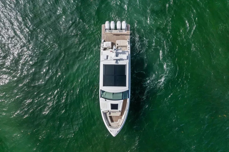 Slide: The Image of Aerial view of 2025 Formula 500 Super Sport Crossover yacht on green water. - 5