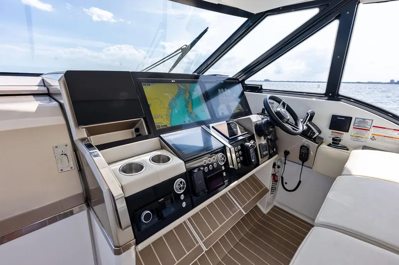 Slide: The Image of 2025 Formula 500 Super Sport Crossover helm with advanced navigation displays and controls. - 51