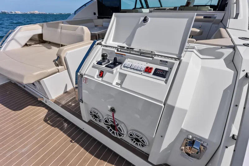 Slide: The Image of 2025 Formula 500 Super Sport Crossover yacht control panel with luxurious seating and ocean backdrop. - 55