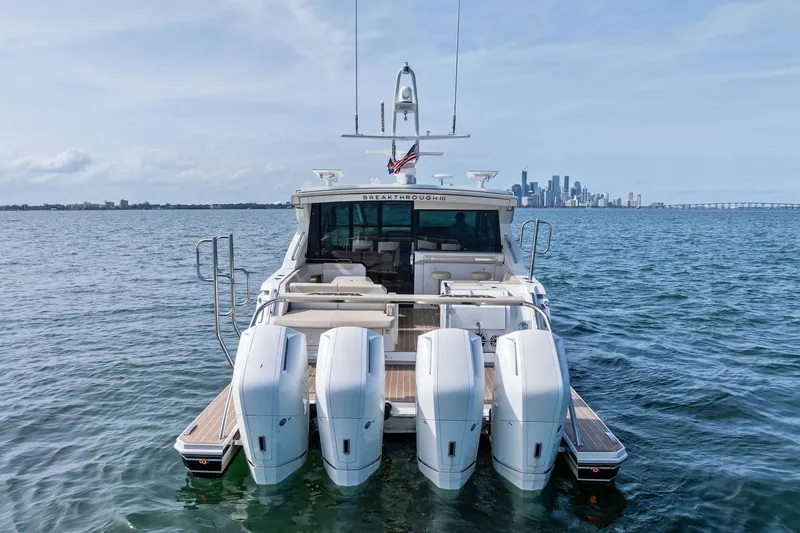 Slide: The Image of 2025 Formula 500 Super Sport Crossover yacht on water with city skyline in background. - 6