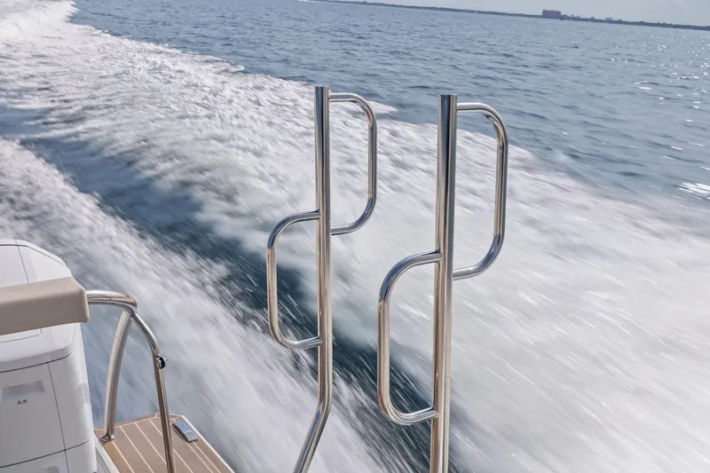 Slide: The Image of 2025 Formula 500 Super Sport Crossover cruising on open water, leaving a wake. - 61