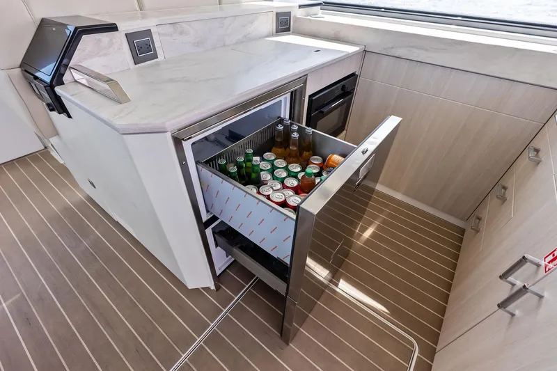 Slide: The Image of Luxury yacht kitchen with open beverage drawer, Formula 500 Super Sport Crossover 2025. - 62