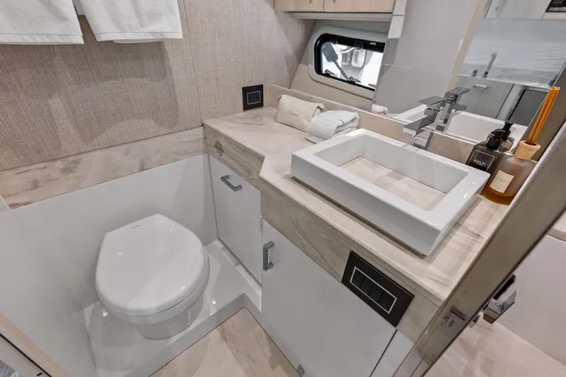 Slide: The Image of Modern bathroom in 2025 Formula 500 Super Sport Crossover yacht, featuring sleek sink and toilet. - 63