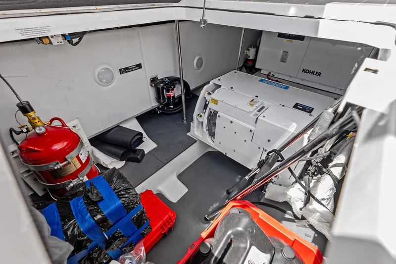 Slide: The Image of Engine compartment of 2025 Formula 500 Super Sport Crossover with Kohler generator and safety equipment. - 65