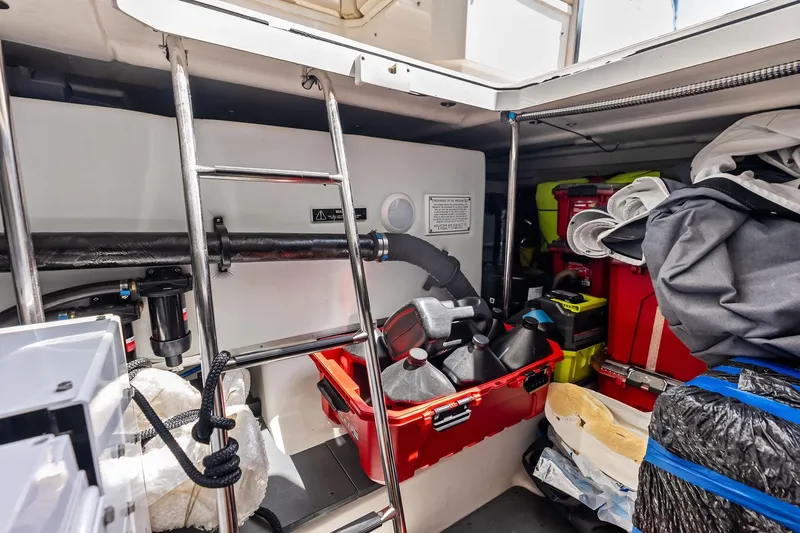 Slide: The Image of Interior storage area of 2025 Formula 500 Super Sport Crossover boat, featuring equipment and supplies. - 67