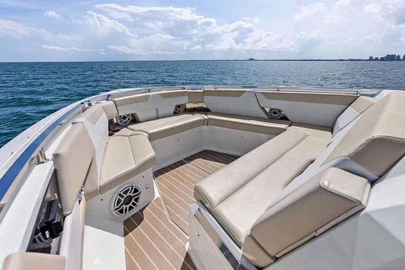 Slide: The Image of 2025 Formula 500 Super Sport Crossover boat interior with luxurious seating on open water. - 8