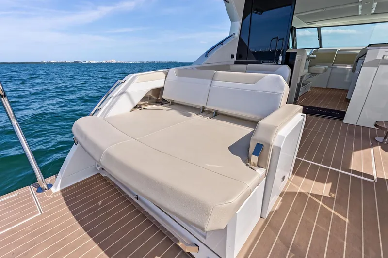 Slide: The Image of 2025 Formula 500 Super Sport Crossover yacht with luxurious seating on open deck. - 9