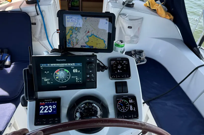 Slide: The Image of Cockpit of 2003 Jeanneau Sun Odyssey 35 with navigation instruments and map display. - 3