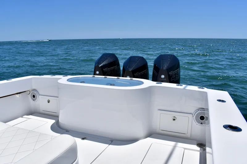 Slide: The Image of 2022 Onslow Bay 41 Tournament boat with triple engines on open sea. - 15