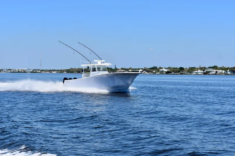 Slide: The Image of 2022 Onslow Bay 41 Tournament boat cruising on open water. - 20