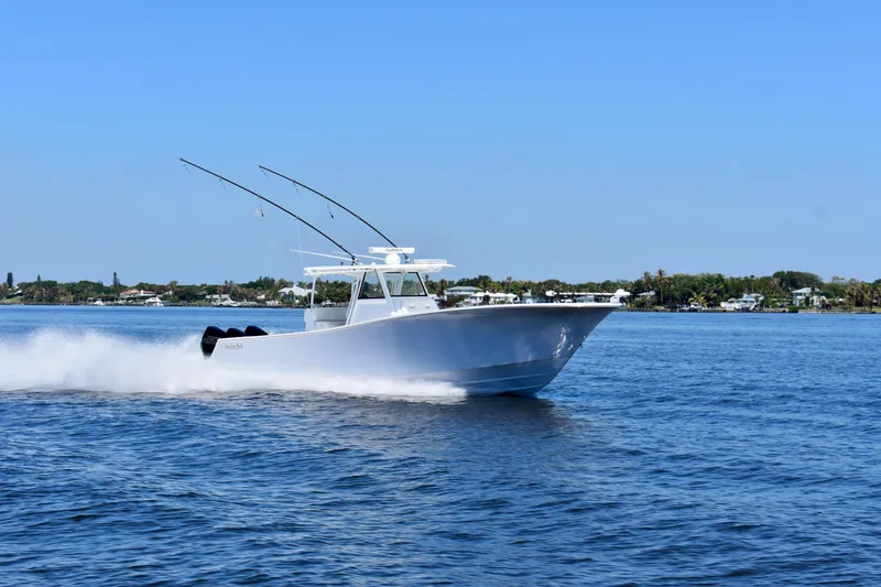 Slide: The Image of 2022 Onslow Bay 41 Tournament boat cruising on open water under clear blue sky. - 27