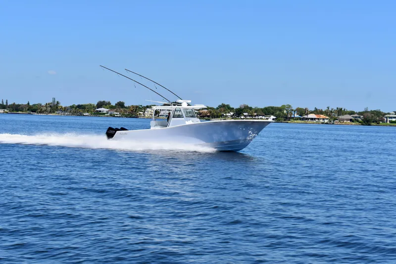 Slide: The Image of 2022 Onslow Bay 41 Tournament boat cruising on a sunny day in open water. - 30