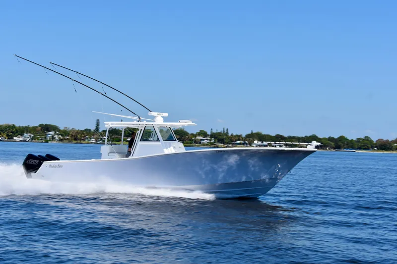 Slide: The Image of 2022 Onslow Bay 41 Tournament boat cruising on open water. - 31
