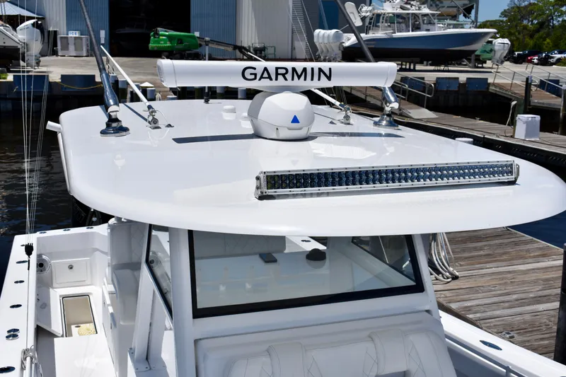 Slide: The Image of 2022 Onslow Bay 41 Tournament boat with Garmin equipment at a marina dock. - 32