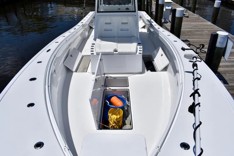 Slide: The Image of 2022 Onslow Bay 41 Tournament boat interior with storage compartments and seating. - 33