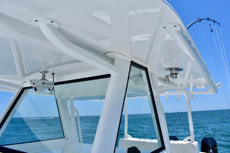 Slide: The Image of 2022 Onslow Bay 41 Tournament boat, showcasing sleek design and ocean backdrop. - 8