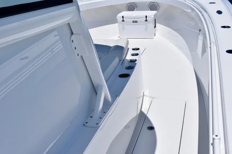 Slide: The Image of 2022 Onslow Bay 41 Tournament boat deck with seating and Yeti cooler. - 9