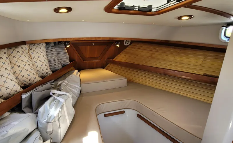 Slide: The Image of Interior of 2015 Eastport 32 OBX yacht with elegant wood paneling. - 11