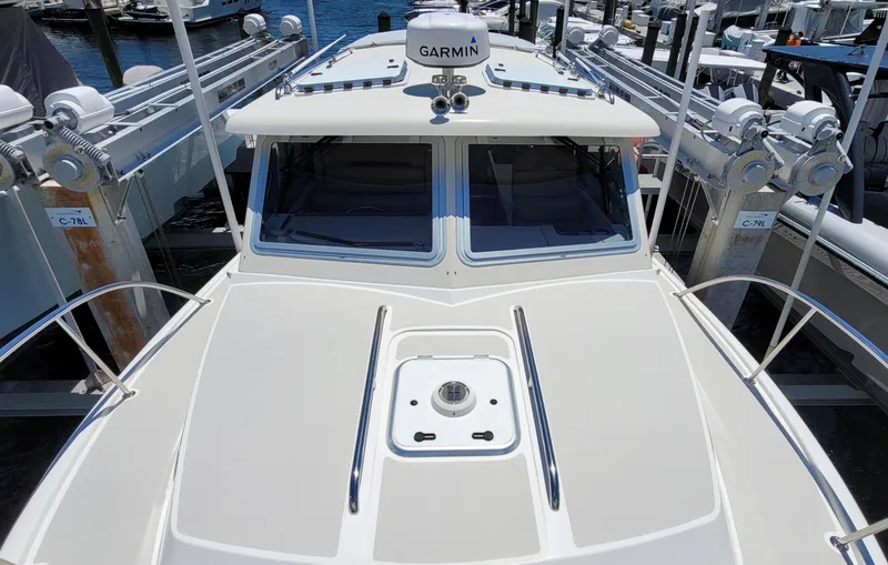 Slide: The Image of Eastport 32 OBX 2015 boat with Garmin equipment at the dock. - 14