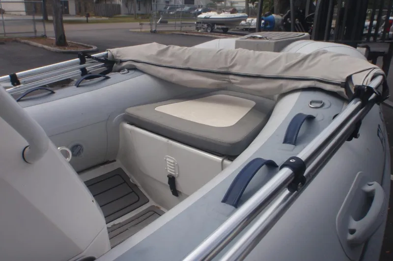 Slide: The Image of 2022 Highfield Classic 360 GT inflatable boat interior with seating and storage. - 3