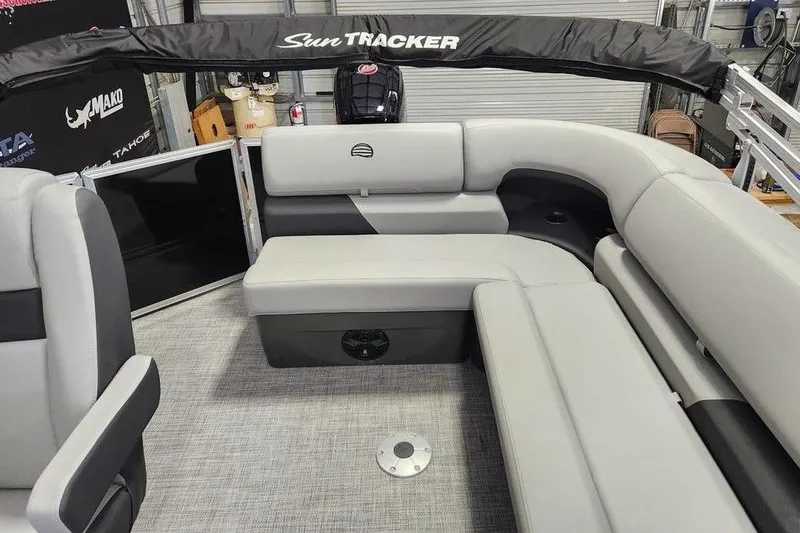 Slide: The Image of 2026 Sun Tracker Party Barge 20 DLX interior with gray seating and black accents. - 8