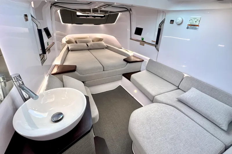 Slide: The Image of Luxurious interior of 2025 Axopar 37 XC Cross Cabin with modern seating and bed. - 12