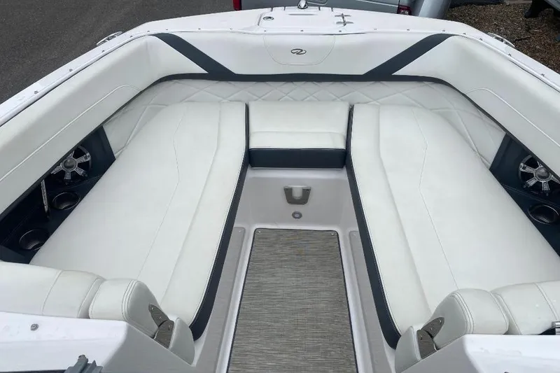 Slide: The Image of Interior of a 2018 Regal 26 FasDeck boat with white seating and modern design. - 15