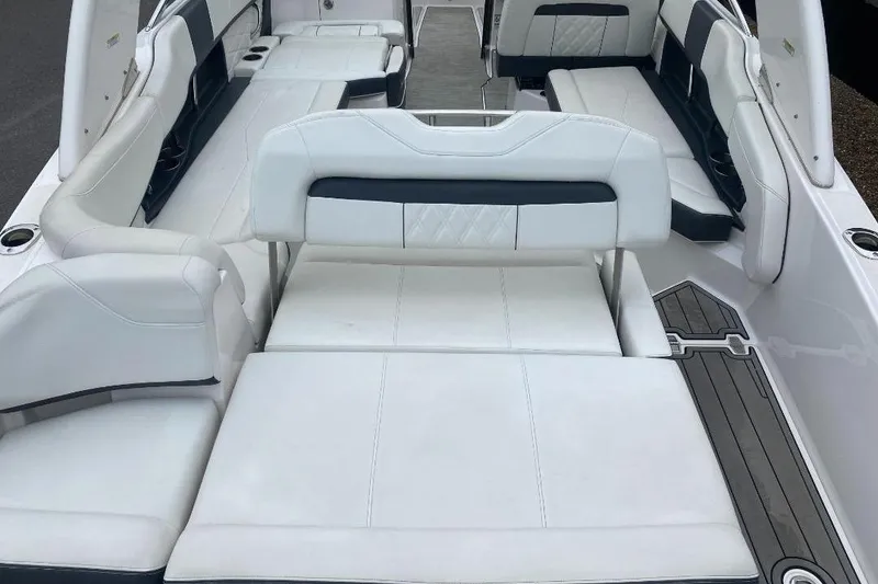 Slide: The Image of 2018 Regal 26 FasDeck boat interior with white seating and sleek design. - 6