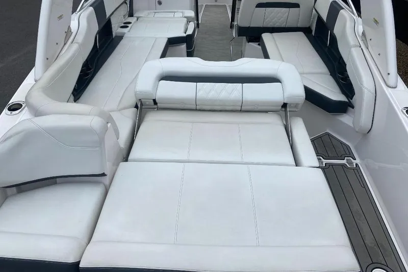 Slide: The Image of 2018 Regal 26 FasDeck boat interior with spacious white seating and sleek design. - 7