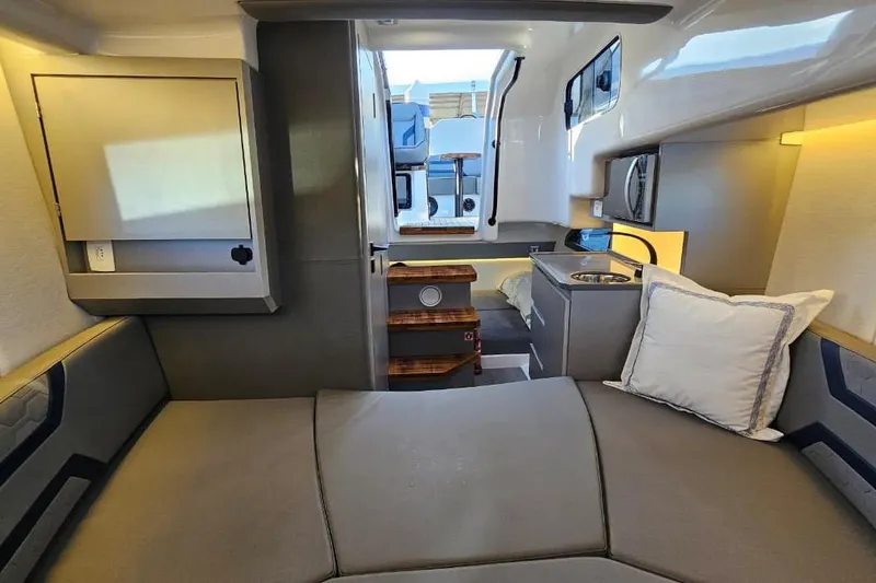 Slide: The Image of Modern interior of 2027 Hanover 327 boat with cozy seating and compact kitchenette. - 12