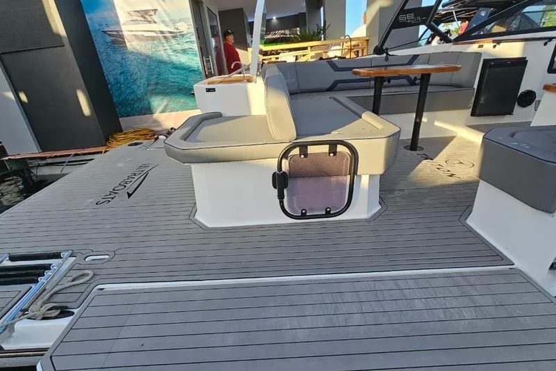 Slide: The Image of Deck view of 2027 Hanover 327 boat with seating and modern design elements. - 16