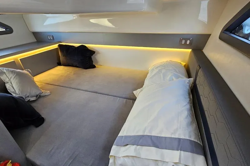 Slide: The Image of Luxurious interior cabin of 2027 Hanover 327 yacht with cozy bedding and ambient lighting. - 17