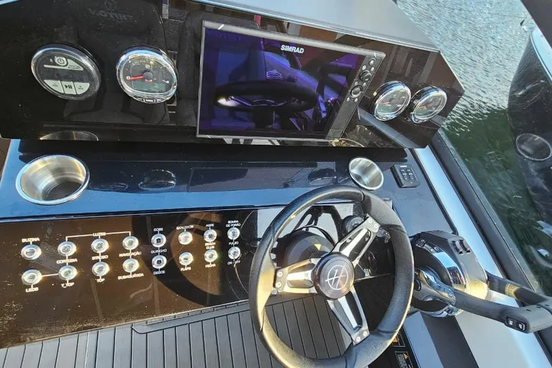 Slide: The Image of Modern boat dashboard with steering wheel, control panel, and digital display, Hanover 327, 2027 model. - 26