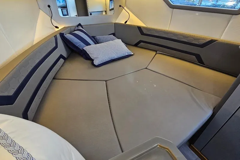 Slide: The Image of Luxurious interior of 2027 Hanover 327 yacht with cozy seating and striped cushions. - 27