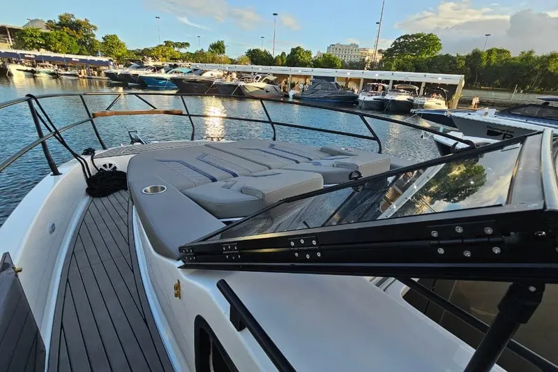 Slide: The Image of Luxurious 2027 Hanover 327 yacht docked, featuring spacious sunbathing area and sleek design. - 28