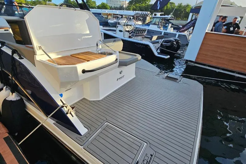 Slide: The Image of Luxury Hanover 327 boat, 2027 model, featuring a sleek deck and outdoor kitchenette. - 30