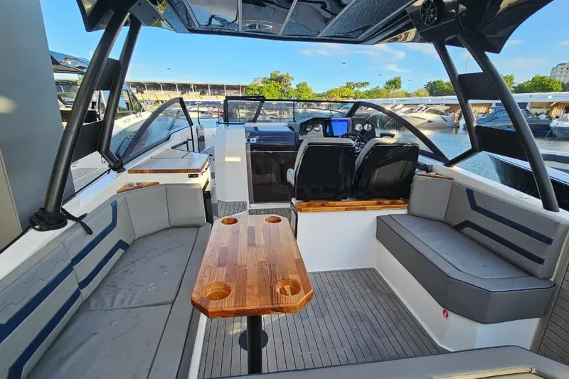 Slide: The Image of Luxurious Hanover 327 boat interior, 2027 model, featuring sleek seating and modern dashboard. - 32