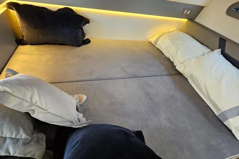 Slide: The Image of Luxurious interior of 2027 Hanover 327 with plush bedding and ambient lighting. - 7