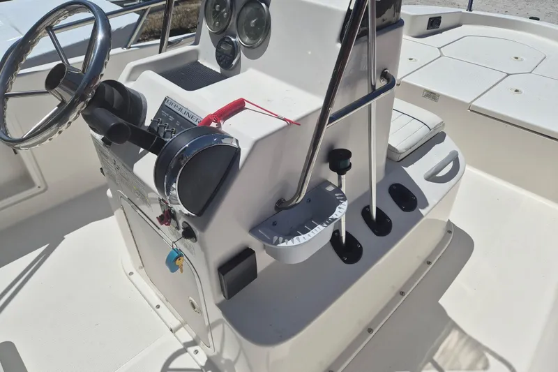 Slide: The Image of 2017 Bayliner Element F18 boat console with steering wheel and controls. - 10