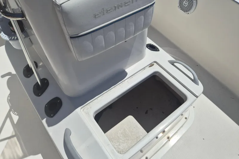 Slide: The Image of 2017 Bayliner Element F18 boat interior with open storage compartment. - 14