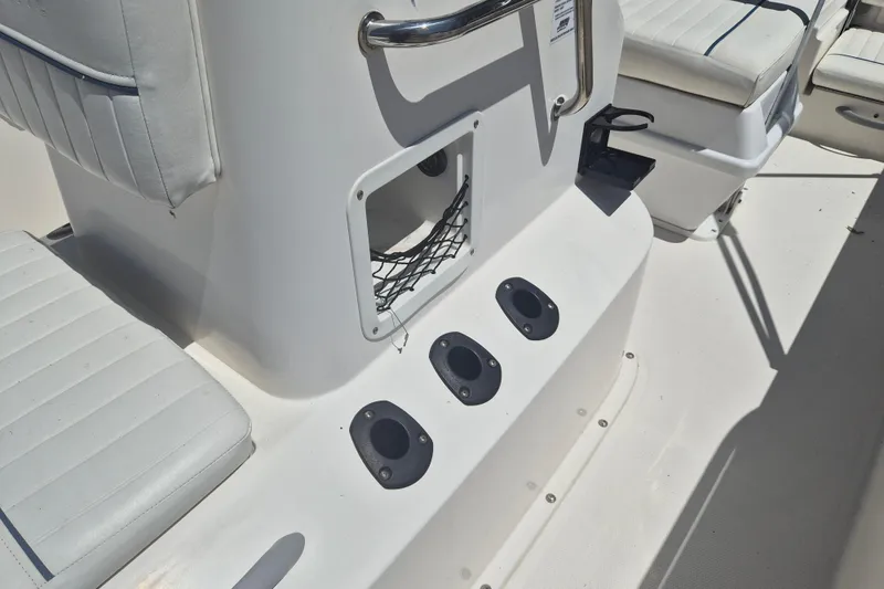 Slide: The Image of 2017 Bayliner Element F18 boat interior with seating and rod holders. - 15