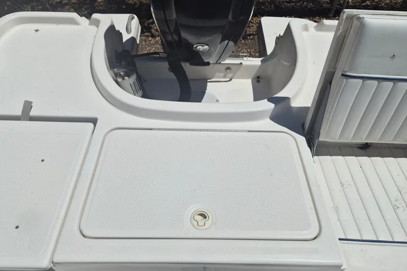 Slide: The Image of 2017 Bayliner Element F18 boat deck with seating and motor area. - 8