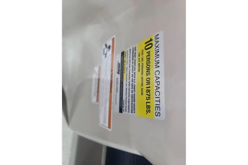 Slide: The Image of Capacity label on 2018 Manitou 22 Aurora LE Angler, max 10 persons or 1875 lbs. - 20